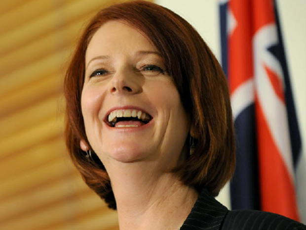Australia appointed its first woman prime minister, Julia Gillard, who vowed on Thursday to end division over a controversial mining tax, resurrect a carbon trade scheme and call elections within months.