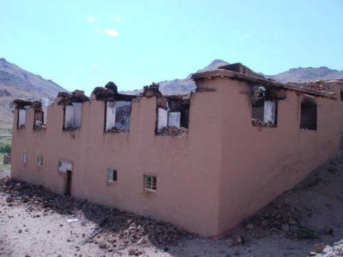 Hazara home burned and looted by Kuchi
