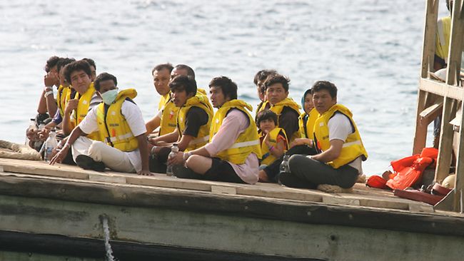 Dreaming of freedom: A boatload of refugees arrive in Australian waters. Picture: Colin Murty Source: Herald Sun