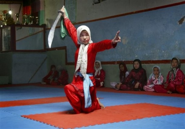 A Hazara girl practices the martial arts with a sword at a Wosho training club in Injil, Herat province west of Kabul, Afghanistan on Wednesday, April 6, 2011. (AP Photo)