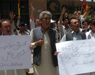 Hazara Democratic Party activists outside the Quetta Press Club May 18 protest the slayings of Hazara Shia community members. About 25 Hazaras have been killed in three different attacks in Quetta in the past two months. [Zia Ur Rehman