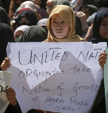 Reuters Pictures: Ethnic Hazara Shi'ite women hold placards during a demonstration in Quetta September 21, 2011 to condemn the shootout by unidentified gunmen, a day earlier. Gunmen opened fire on a bus in Pakistan's southwestern province of Baluchistan in a suspected sectarian attack on Tuesday, killing at least 26 Shi'ite Muslim pilgrims traveling to Iran, police said.