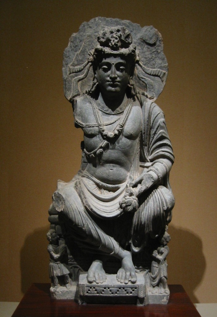 Maitreya, with Kushan devotee couple. 2nd century Gandhara